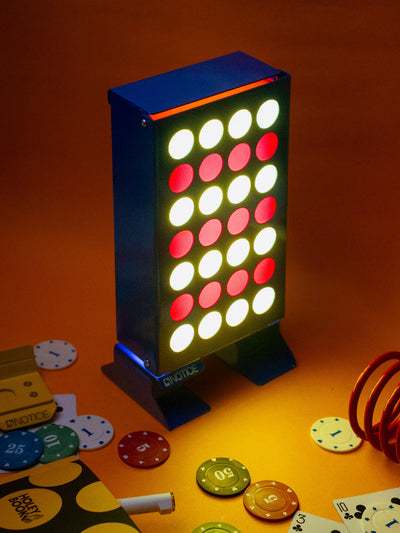 Stack 4 Lamp lit on a desk among poker chips, red and yellow slabs glowing
